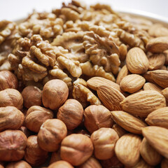 The close-up view accentuates the rich textures of walnuts, almonds, and hazelnuts, highlighting their natural appeal and the promise of nutrition they hold. Textured Nut Selection Close-Up