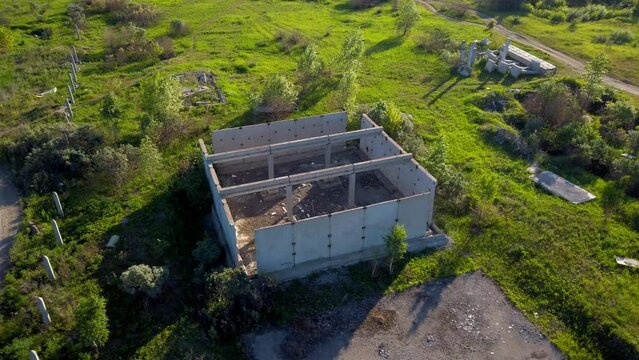 Abandoned building in a field on a sunny day. High quality 4k footage