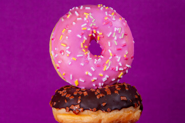 Set of doughnuts on colored background.