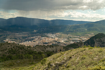 Fototapeta na wymiar landscape with Alcoy city on background, with the storm coming