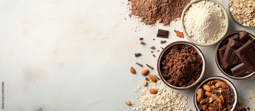 Poster a table is filled with bowls containing a variety of different types of food. the assortment include