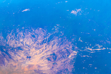 Flying airplane over Mexico Clouds Sky Volcanoes Mountains City desert.