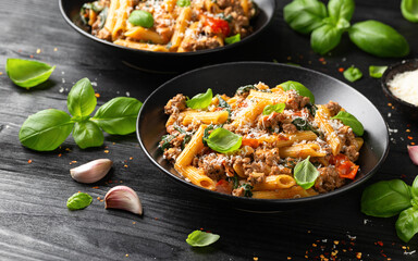 Creamy Tuscan pasta with minced beef, sun dried tomatoes, spinach and parmesan cheese