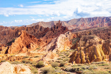 Fototapeta premium landscape of Skazka canyon on Issyk-Kul lake. Rocks Fairy Tale famous destination in Kyrgyzstan. Mountain like great wall of china and Rainbow Mountains of Danxia or Antelope crevice USA. Central Asia