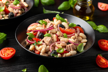 White bean tuna salad with olive, red onion, tomatoes. Healthy food - obrazy, fototapety, plakaty