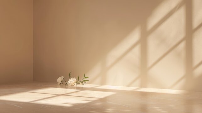 a vase filled with white flowers sitting on top of a hard wood floor in a room with a large window.