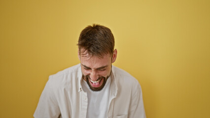 Joyful young hispanic man with beard, confidently laughing a lot in a stylish, casual fashion,...