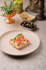 Viennese waffle with salmon and butter cream. holiday breakfast