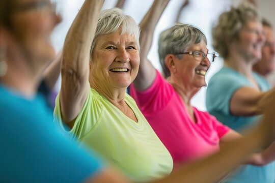 a group of older women are doing exercises together in a gym