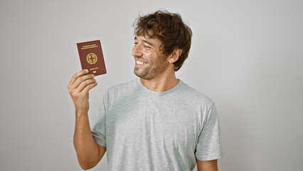 Confident young blond man, a happy greek patriot, smiling with joy as he holds his passport, ready...