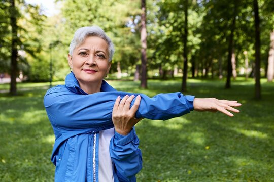 Summertime Image Healthy Active Retired Woman Smiling Stretching Arm Muscles After Running Training Outdoors Posing Forest Health Well Being Age People Sports Activity Concept