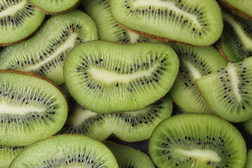 Close-up of kiwi fruit background with space for copy space text. Kiwi slices with a beautiful slit