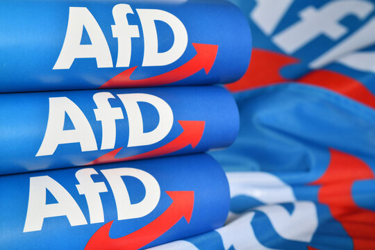 Burgdorf, Lower Saxony, Germany - February 19, 2024: Paper flags with the logo of  the right-wing political party Alternative for Germany, AfD