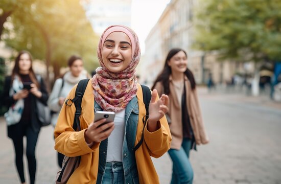 A beautiful Muslim student wearing a hijab is seen using a smartphone while strolling through the urban streets, seamlessly blending tradition with modernity in a diverse and vibrant cityscape