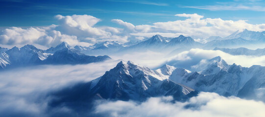 Breathtaking Mountain Panorama with Snow-Covered Peaks of a Alpine Mountain Massif with Blue Sky and Clouds - Landscape of Majestic Mountains with Snow