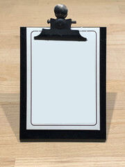 clipboard with white blank paper and wooden background
restaurant menu paper list