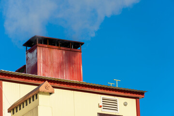 Snow and ice on the roofs of buildings. Icicles hang from the roofs of houses. The probability of the roof collapsing under the weight of snow.