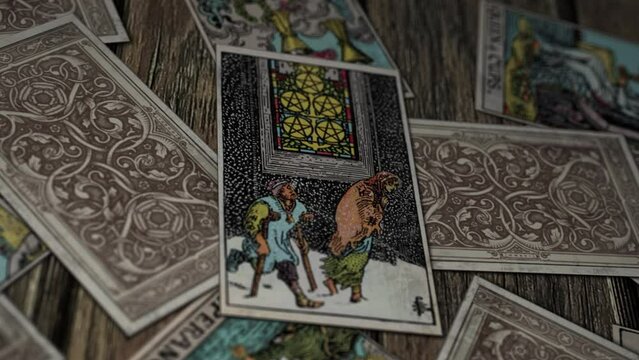 Madrid, Spain - June 12, 2014. Tarot card Five of Pentacles for future divination. Medieval card interpretation for future divination. Future divination of the possible poverty. Mysterious witchcraft
