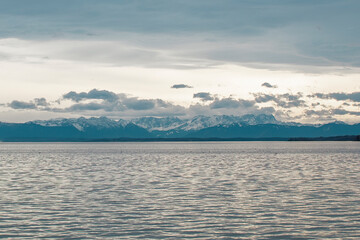 View of Lake Starnberg in Bavaria and the Alps. Lake Starnberg with the Alps in the background