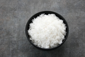Grated coconut (kelapa parut) on bowl, food preparation
