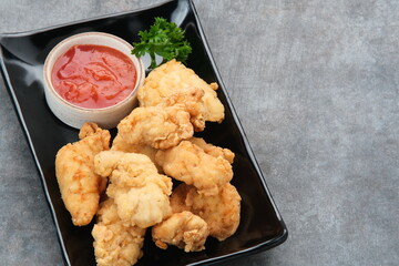 Crispy chicken fillets (ayam goreng tepung) with chilli sauce
