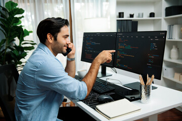 Smart IT developer manager calling to coworker solving problem in software coding system on pc...