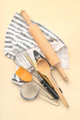 Composition with different utensils for preparing bakery on color background