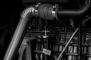Black diesel engine. Fragment of a diesel motor close-up. Selective on the fuel injection in the...