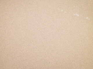 Sea water on sandy beach sand - nature background.