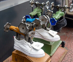Device for stretching shoes. Shoemaker's tool. Shoe repair concept. Small business.