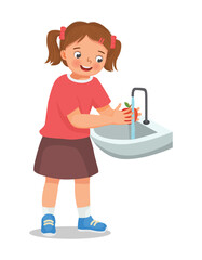 Cute little girl washing apple fruit at the sink