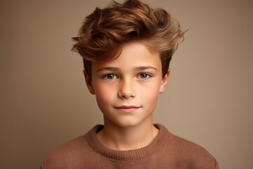 Portrait of a cute little boy with blond hair. Studio shot.