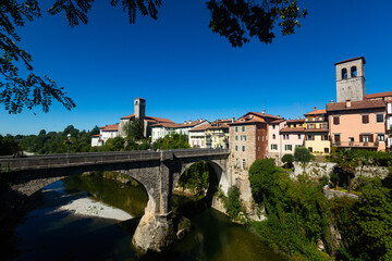 Fototapeta na wymiar Cividale del Friuli and the Devils Bridge (Ponte del Diavolo) on the Natisone river. Italy