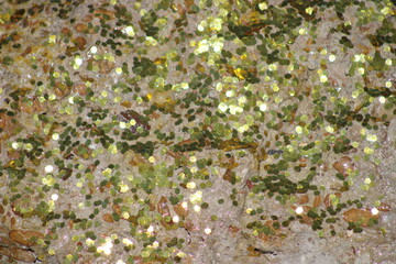 A Leprechaun has already sprinkled the barney stone with specks of gold. The sun was reflecting from the glitter and cars were stopping as they turned into the driveway parking lot to take a look.