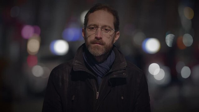 Male Person with Glasses Standing Out of the Crowd Thoughtfully Uncertain