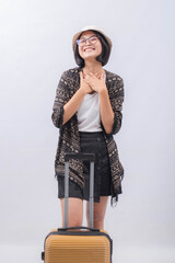 Portrait of Young Asian Woman carrying suitcase for vacation