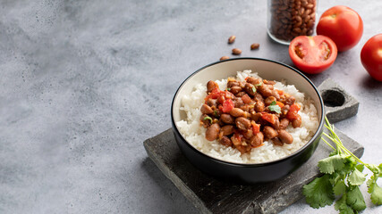 Vegan bean curry with rice and tomatoes. Indian cuisine. Vegetarian dish. 