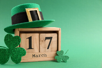 St. Patrick's day - 17th of March. Wooden block calendar, leprechaun hat and decorative clover...