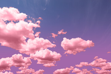 Pink fluffy clouds floating in beautiful sky