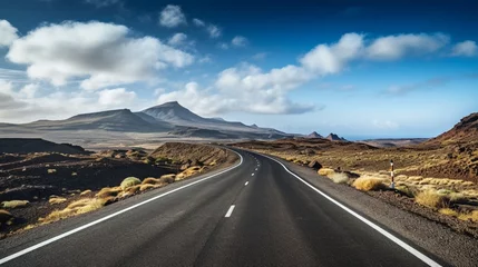 Poster Image related to unexplored road journeys and adventures.Road through the scenic landscape to the destination in Lanzarote natural park © Wajid