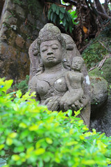 Fototapeta na wymiar an old stone Buddha statue at nature