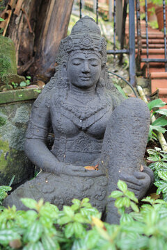 an old stone Buddha statue at nature