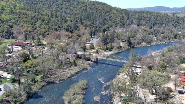 North Fork of the American River at the gold discovery site in Coloma, California showing the rapids and the Sutter Bridge. 
