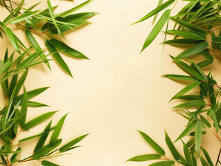 Copy space for text on a beige backdrop adorned with green bamboo leaves.