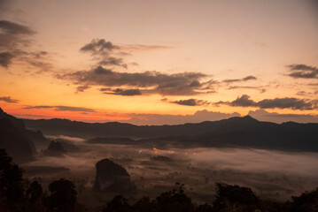 Scenic view dramatic beautiful sunset sky. Natural Sunset Sunrise on meadow silhouette shadow dark land. Vibrant dramatic sky on sunset, dawn, sunrise in Countryside. Landscape Colorful Sky At Sunset