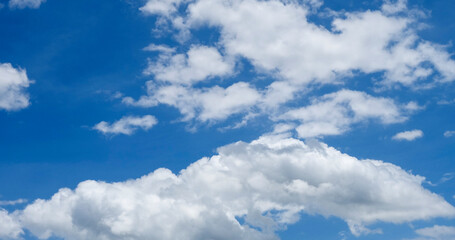 Panorama blue sky clouds pattern on daylight with copy space. Cumulus cloudscape air climate sunny day. Blue sky fluffy white clouds on summer season bright clear skyline with beautiful cloudscape