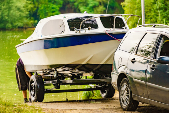 Small yacht on car trailer. Boat launch