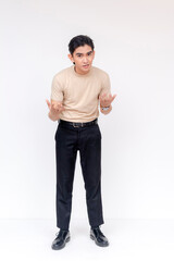 Full body portrait of an angry young Asian man berating someone during a heated argument or debate.