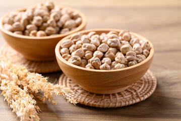 Organic dried chickpea in wooden bowl, Healthy food ingredient