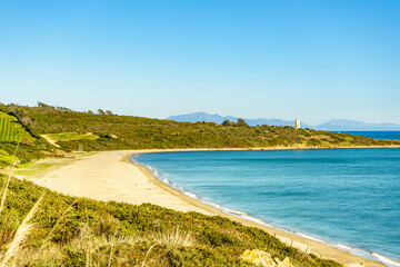 Fototapeta na wymiar Coast with sandy beach and lighthouse, Spain.